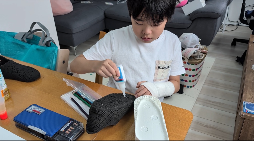 Kanata gluing a printed upper to a sole