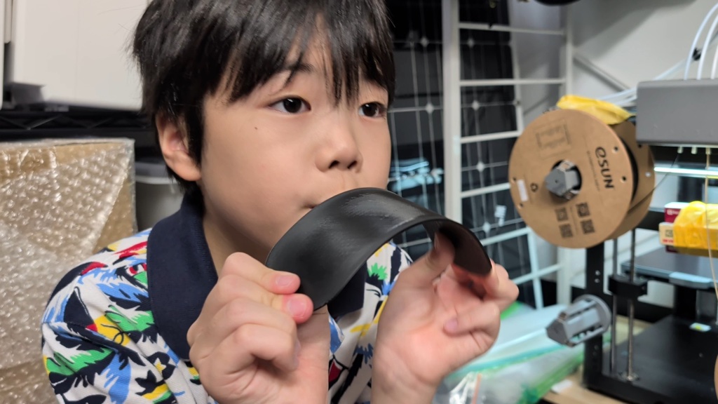 Bending the polycarbonate plate to test its spring-back
