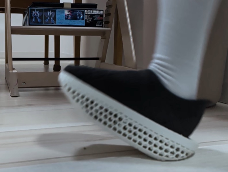 Slow-motion side view of the K-Dash sole as the foot touches down