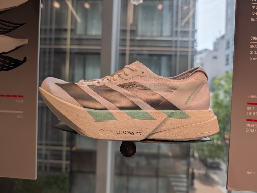 Running shoes with raised toes and thick soles on a store shelf