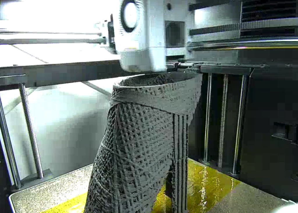 The black mesh upper being printed